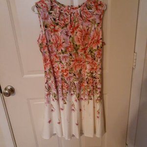 **SOLD**Gabby Skye Size 12. Pink/flowered dress with cutouts at the neck